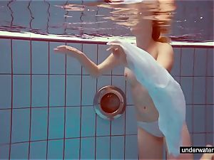 adorable red-haired plays nude underwater